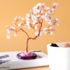 Árbol de piedras de cuarzo rosa sobre base de ágata rosa